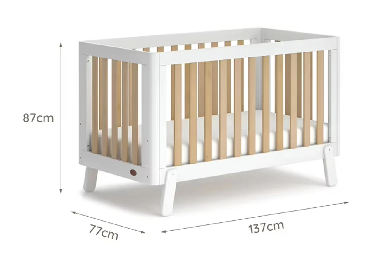 White wooden cot bed with its overall dimensions marked as 137 centimeters long, 77 wide and 87 high White wooden cot bed with its overall dimensions marked as 137 centimeters long, 77 wide and 87 high